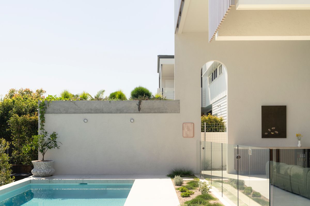 Pool courtyard viewed through the entry archway — House on Pacific