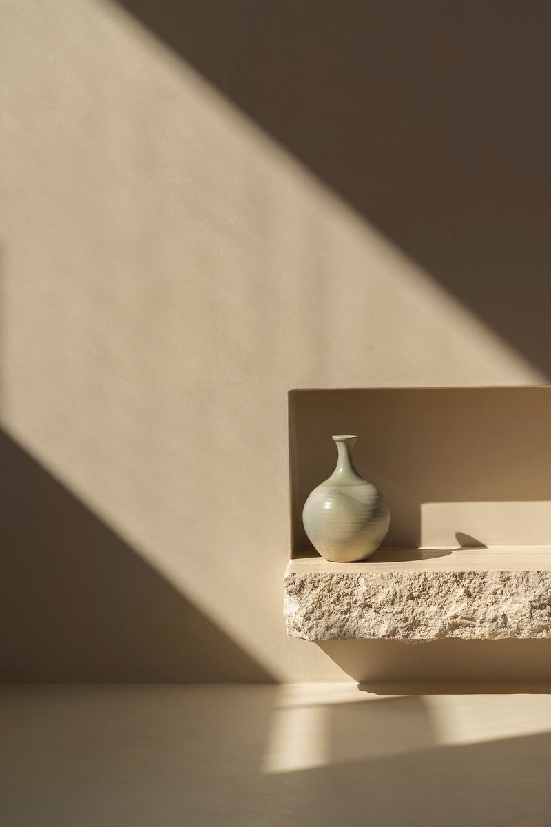 Sculptural stone shelf detail in afternoon light — House on Pacific