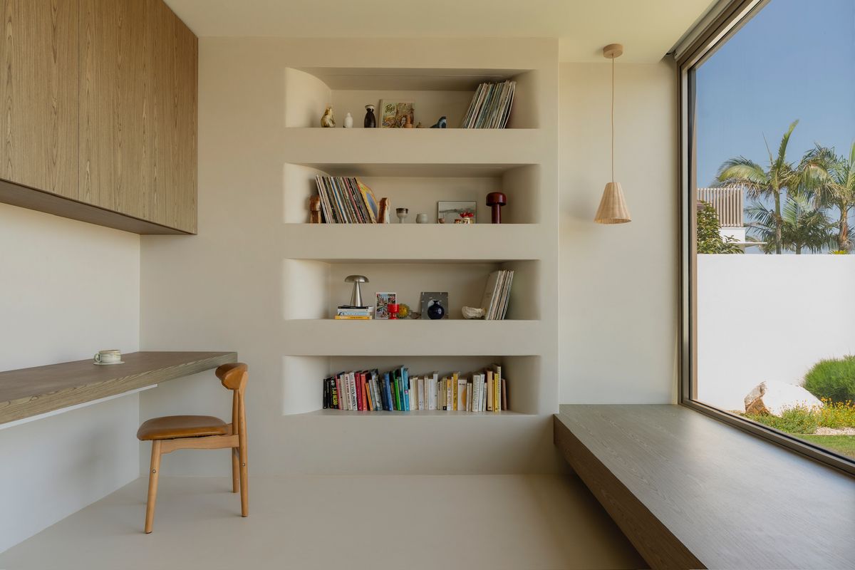 Study nook with built-in shelving — House on Pacific