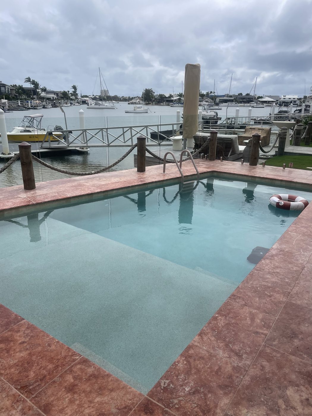Waterfront concrete pool overlooking the marina — Sherwell Building & Construction
